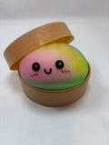 Jeu sensoriel Bun Squishy arc-en-ciel jaune, vert et orange