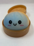 Jeu sensoriel Bun Squishy arc-en-ciel bleu et jaune