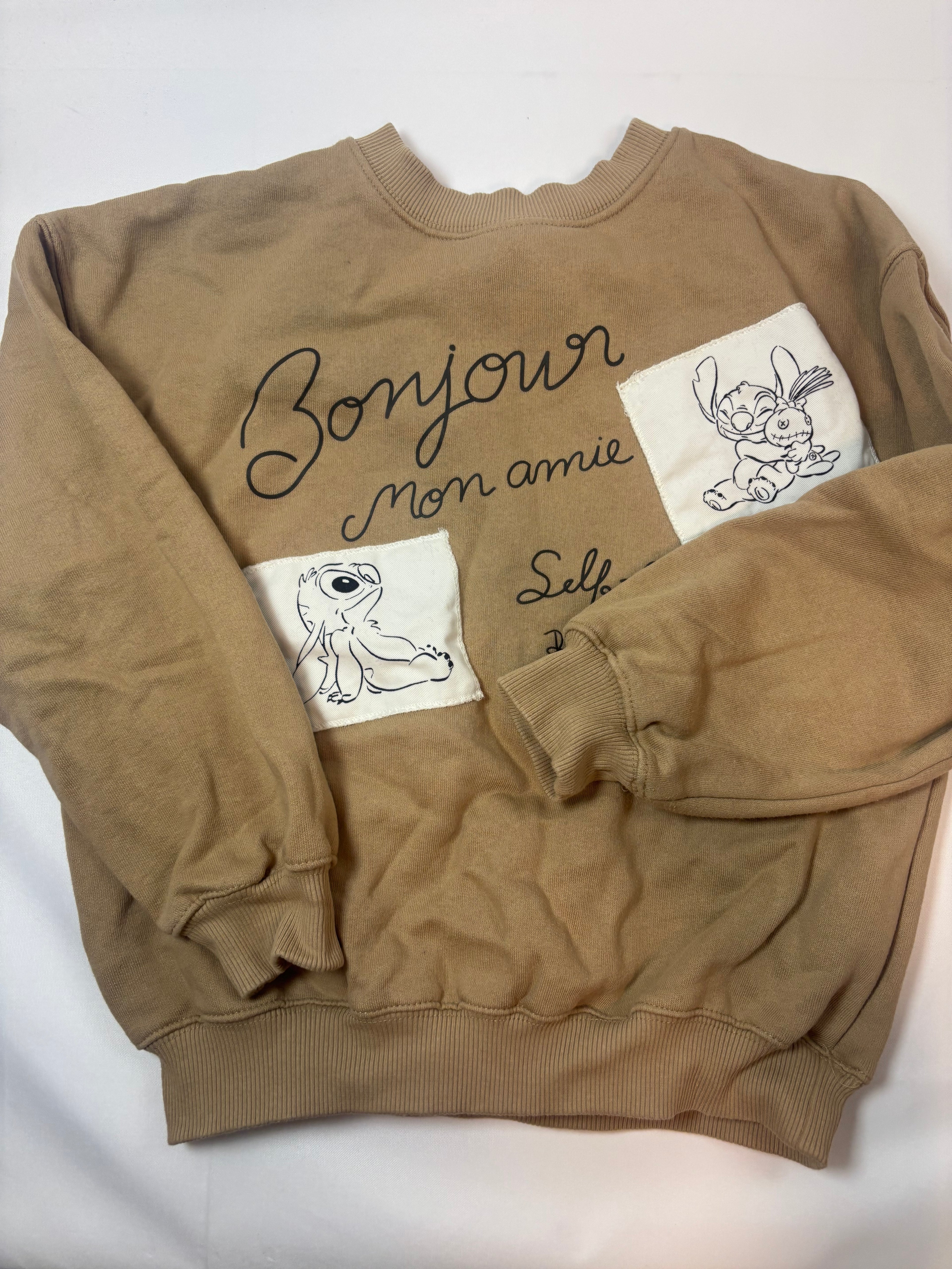 Pull beige motif Stitch – Taille 140