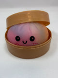 Jeu sensoriel Bun Squishy arc-en-ciel rose et violet